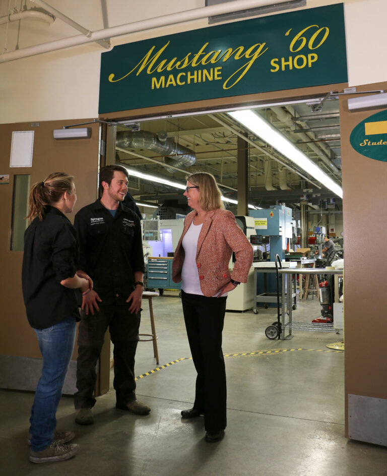 College of Engineering Dean Amy S. Fleischer with Student Shop Techs at the Mustang '60 Machine Shop.